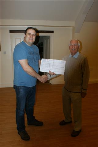 Paul presents a cheque for 150 raised for Sittingbourne MS to Smith Adams